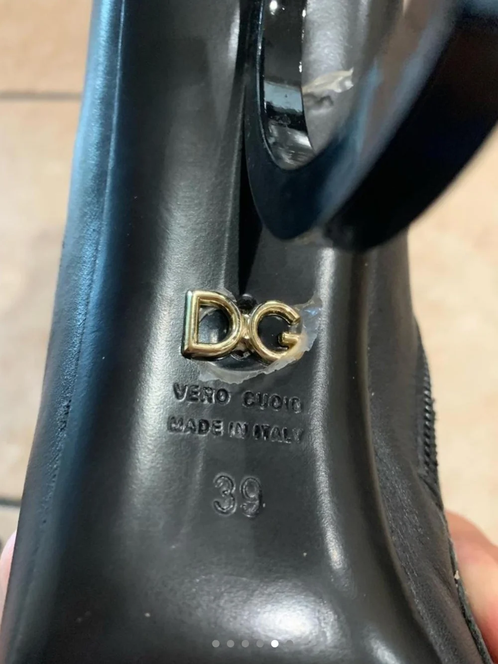 Dolce & Gabbana Black Leather Pointed Ankle Boots with Sculptural Logo Heels